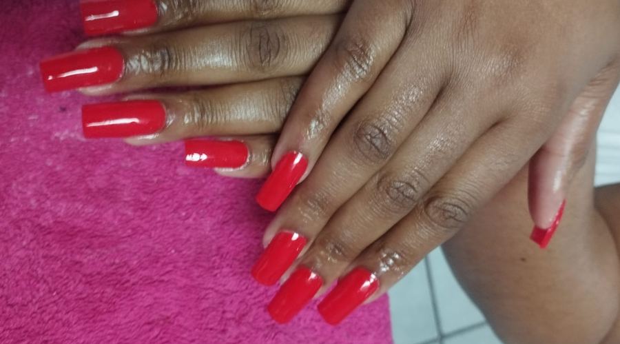 Long square acrylic nails in glossy red gel